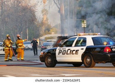 Temple City, California, USA - February 12, 2016: Fire Fighter Extinguishing A Burning Car, California