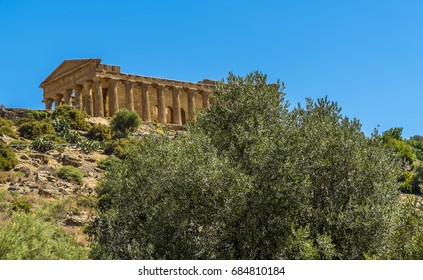 The Temple Of Concordia On A Ridge Above The Plain Around The Sicilian City Of Agrigento, In Summer 