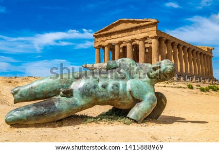 Temple of Concordia and the statue of Fallen Icarus, in the Valley of the Temples, Agrigento, Sicily, Italy