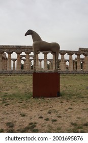 Temple Of Hera Behind A Sand Horse Statue At Paestum, Campania, Italy