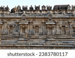 Temple wall with relief carvings. Stone wall of ancient Indian temple of Airavatesvara Temple, Darasuram, Kumbakonam, Tamilnadu.