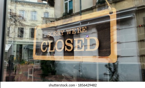 Temporarily Closed Sign For Covid-19 In Small Business Activity. Close Up On Closed Placard In The Window Of A Shop For Coronavirus.