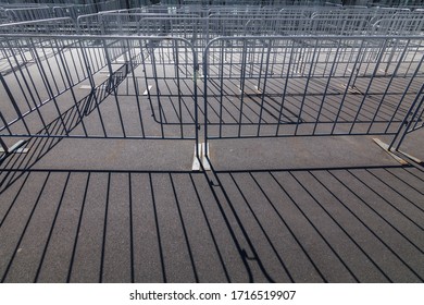 temporary barriers in front of the stadium entrance - Shutterstock ID 1716519907
