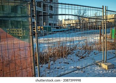 Temporary Fencing Of A Construction Site On A Winter Day