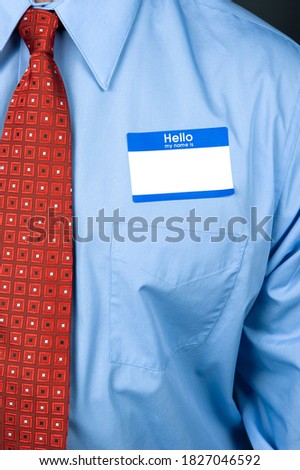 Temporary name tags on the chest of a businessman to help identify his name at a seminar.