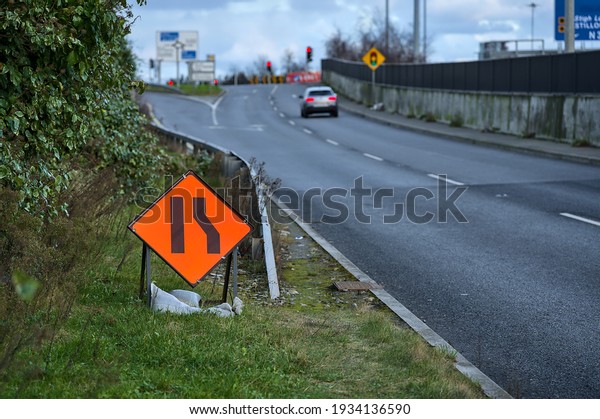 Temporary road sign indication road narrowing\
from right, Dublin,\
Ireland