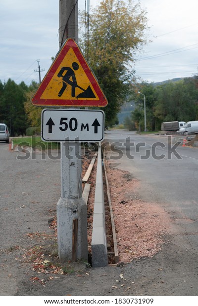 Temporary road signs for road\
repair.