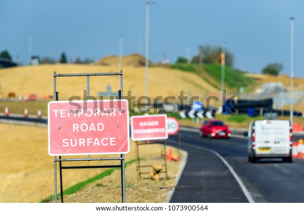 Temporary Road\
Surface Roadworks sign on UK\
motorway