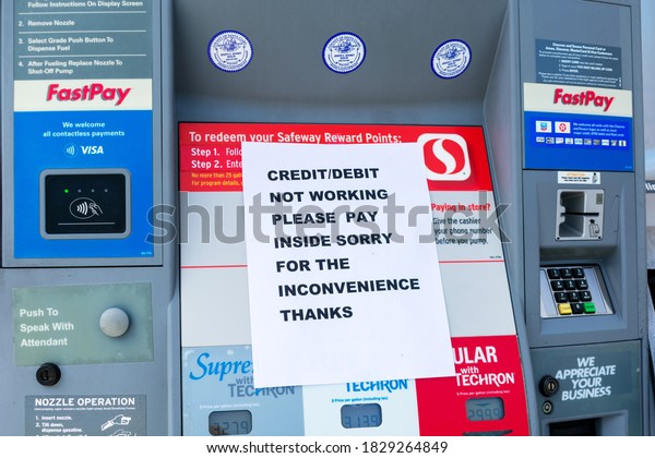 Temporary sign informs gas station customers that
credit and debit payment system currently not working - San Jose,
California, USA -
2020