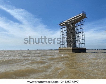 The temporary structure, scaffolding tower at bridge construction site.