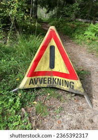 Temporary warning sign at the entrance to a lumbering area written in Swedish. - Shutterstock ID 2365392317
