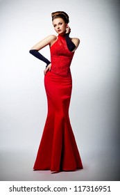Tempting Sexy Slim Female In Sensual Red Long Dress Posing On Formal Party