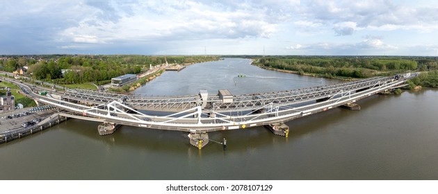 Temse, Belgium 21 May 2021 : Aerial panorama shot of Temse bridge over the river Scheldt in Antwerp. Drone aerial view from above