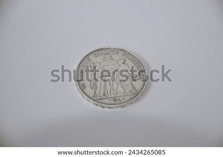 Ten 1967 French francs white background in mint condition