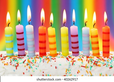 Ten birthday candles on pink background