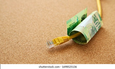 A Ten Rand Note And Internet Cable. Making Money Online In South Africa Concept Image. 