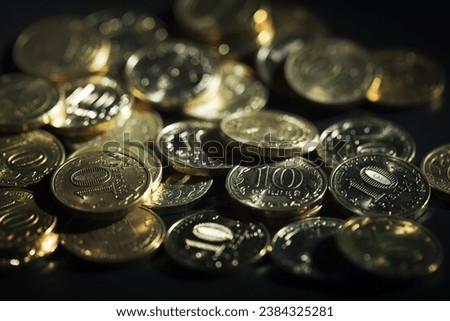 Ten russian rubles coins on black background