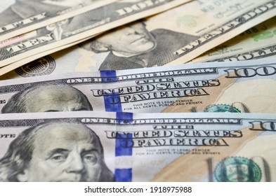 ten, twenty, fifty and one hundred dollar bills background - Shutterstock ID 1918975988