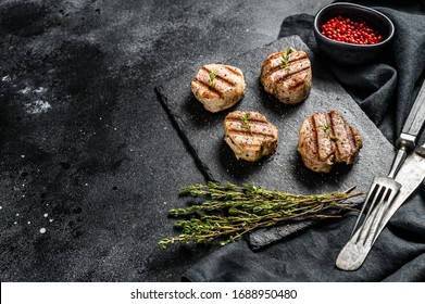 Tender Boneless Grilled Pork Chops. Steak Tenderloin. Black Background. Top View. Copy Space