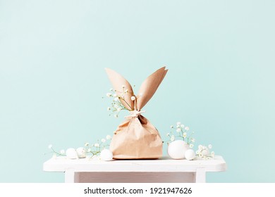 Tender Festive Easter Card With Gifts And Eggs Decorated With Flowers