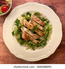 Tender Grilled Chicken Strips Served Over Mixed Salad With Balsamic Dressing. 