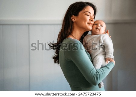 Similar – Image, Stock Photo Caring young Caucasian mother and small son drawing painting in notebook at home together. Loving mom or nanny having fun learning and playing with her little 1,5 year old infant baby boy child.