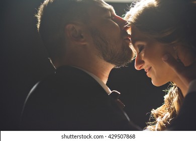 Tender Kiss Of The Groom To The Bride's Forehead