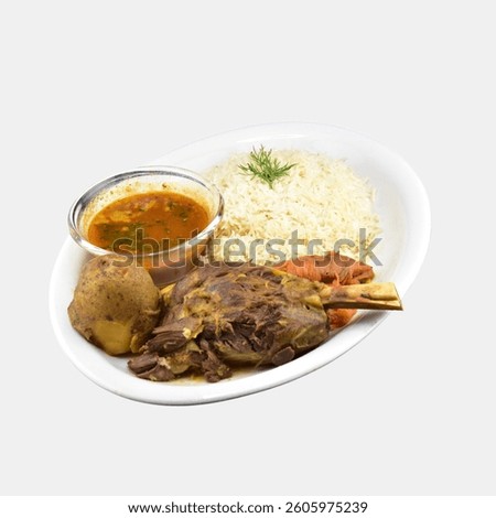 Tender Mutton Leg Served with Aromatic Rice and Spiced Gravy
