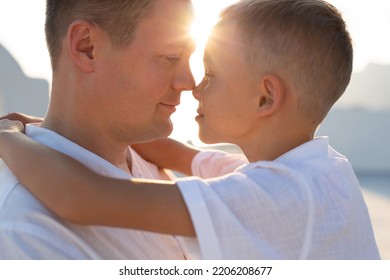 Tender Portrait Of A Father And Son On The Island Of Santorini, Greece