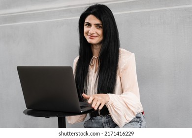 Tender Woman With Vitiligo Hands And Laptop In Cafee Outdoor. Hands With Vitiligo Skin Pigmentation. Lifestyle With Skin Seasonal Disease. Remote Work Online With Laptop