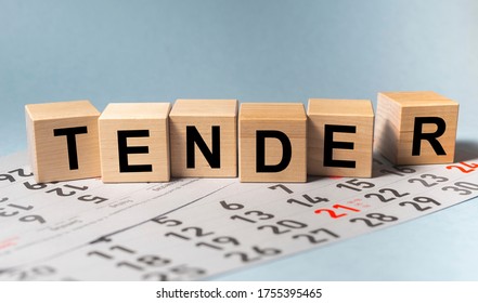 TENDER word on cube block on calendar sheets. date of tender concept - Shutterstock ID 1755395465