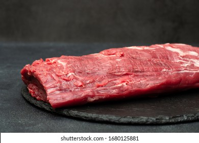 Tenderloin steak. Raw Beef Steak on a black background. 