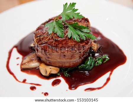 Tenderloin steak wrapped in bacon with demi-glace sauce