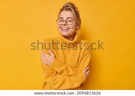 Similar – girl on a yellow air mattress in a grey backyard