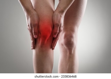 Tendon problems on woman's leg indicated with red spot. Joint inflammation concept. - Shutterstock ID 233836468