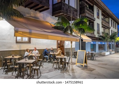 Tenerife, Canary Islands, Spain - January 29, 2019: Nightlife On The Terrace Of A Restaurant In A Central Street Of The City Of Puerto De La Cruz