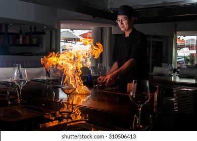 TENERIFE, PUERTO COLON, June 2014 - A Teppanyaki Chef Cooking At  Teppan In A Japanese Steakhouse On Mishi Sushi