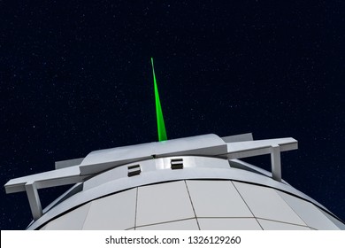TENERIFE, SPAIN - JANUARY 25, 2019: Laser guide star tests at the Teide Observatory. The laser beam is clearly visible at naked eye. 