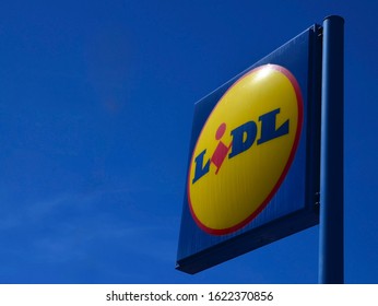 Tenerife,Canary Islands,Spain - February 21, 2019: Lidl supermarket logo on a blue sky background. Lidl is popular German global discount supermarket chain.