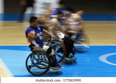 Teng Ho-Cheng (L) Of Taiwan Fight For A Ball With Malaysian Players During The Men's Wheelchair Basketball Competition Of The 2018 Asian Para Games In Jakarta On October 7, 2018