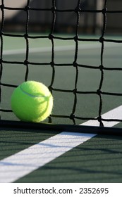 Tennis ball against the net verticle shot
