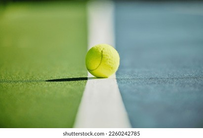 Tennis ball, court and green texture of line between grass and turf game with no people. Sports, empty sport training ground and object zoom for workout, exercise and fitness for a match outdoor - Powered by Shutterstock