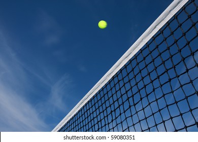 Tennis Ball Flying Over The Net