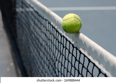 Tennis Ball Hitting The Net