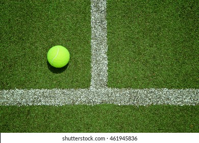 tennis ball near the line on tennis grass court good for background