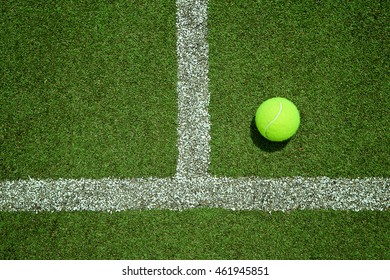 tennis ball near the line on tennis grass court good for background