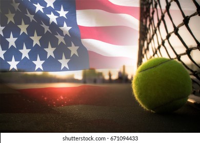 Tennis Ball On Court And U.S. Flag Waving