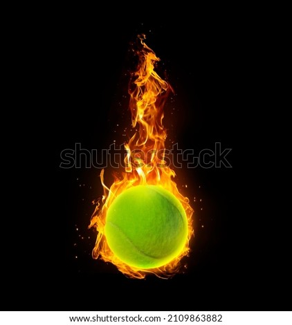 Tennis ball, on fire on black background