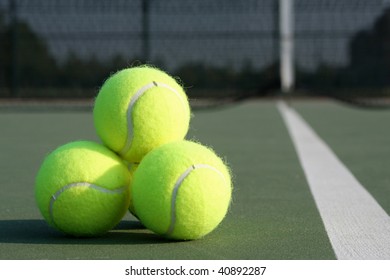 Tennis ball pyramid on the court - Powered by Shutterstock