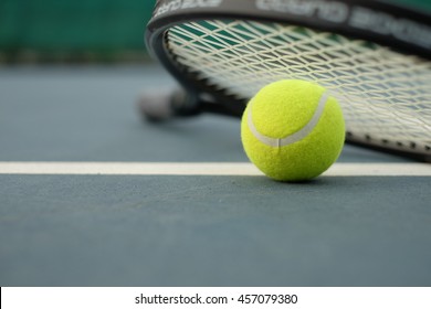 Tennis Ball And Racket On The Court